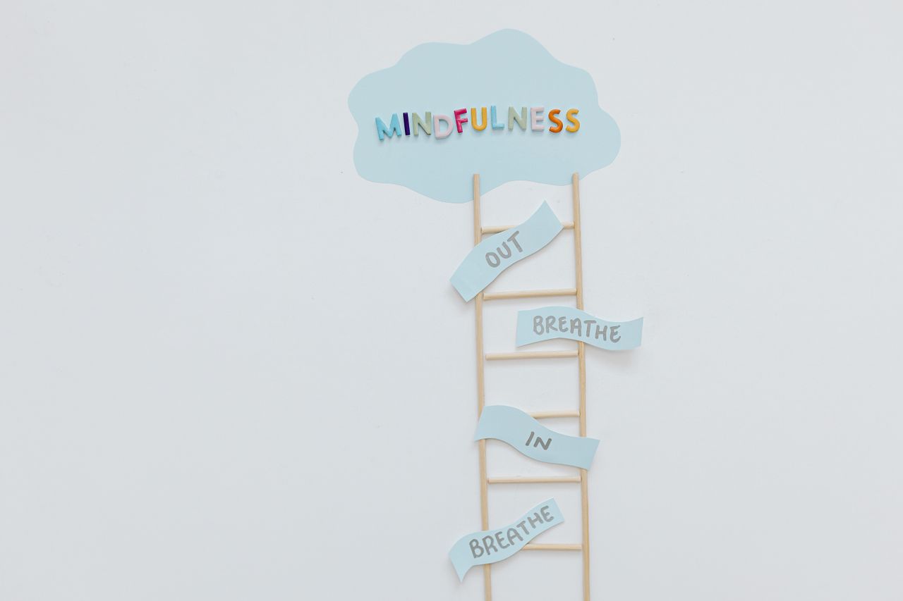 How Mindfulness Enhances Mental Health Therapy Creative mindfulness concept with ladder, words, and cloud shape for mental well-being.